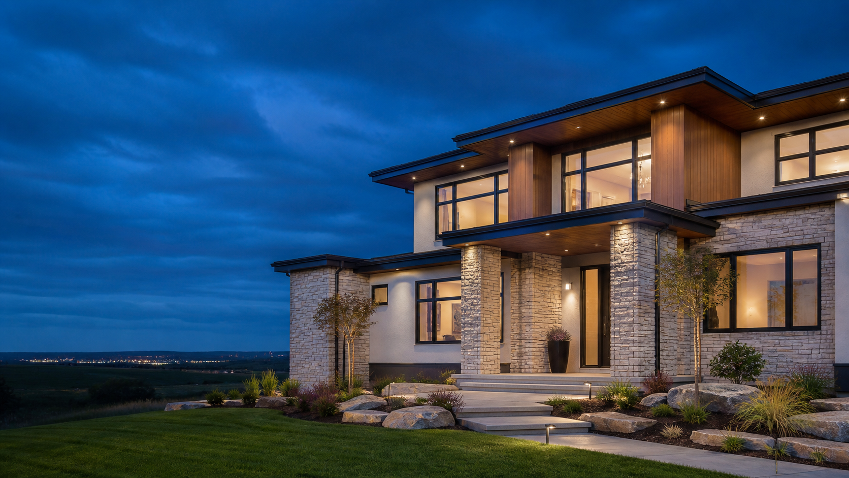 Contemporary custom-built home illuminated at dusk